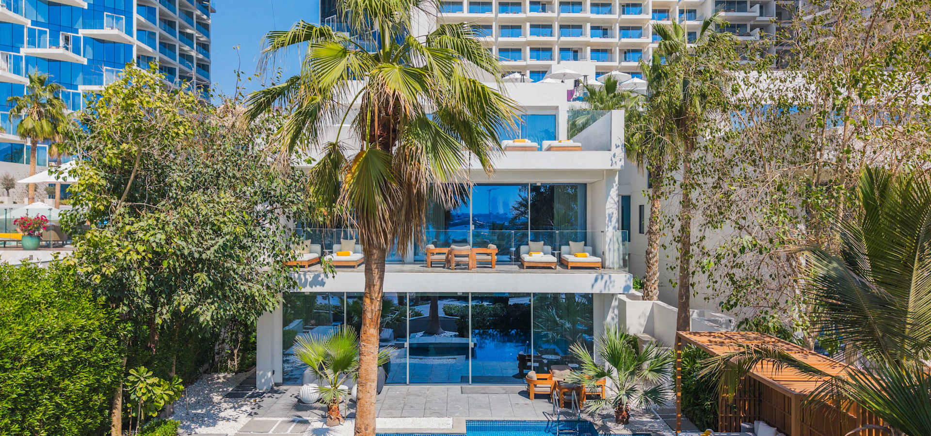 A FIVE Palm Jumeirah beachfront villa and its private pool seen from above
