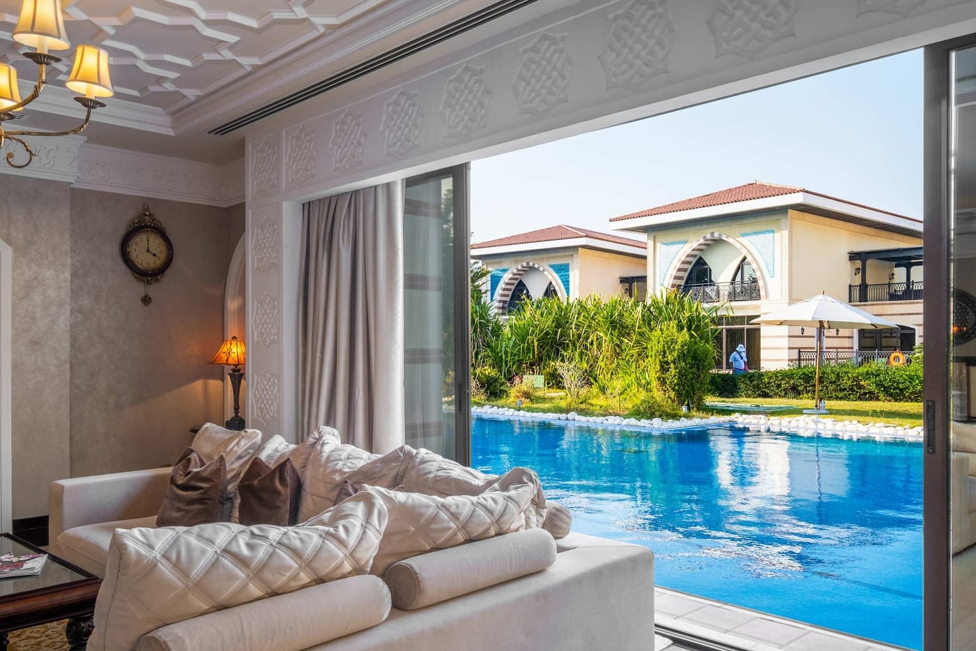 Living room opening onto the lagoon pool at the Zabeel Saray villa